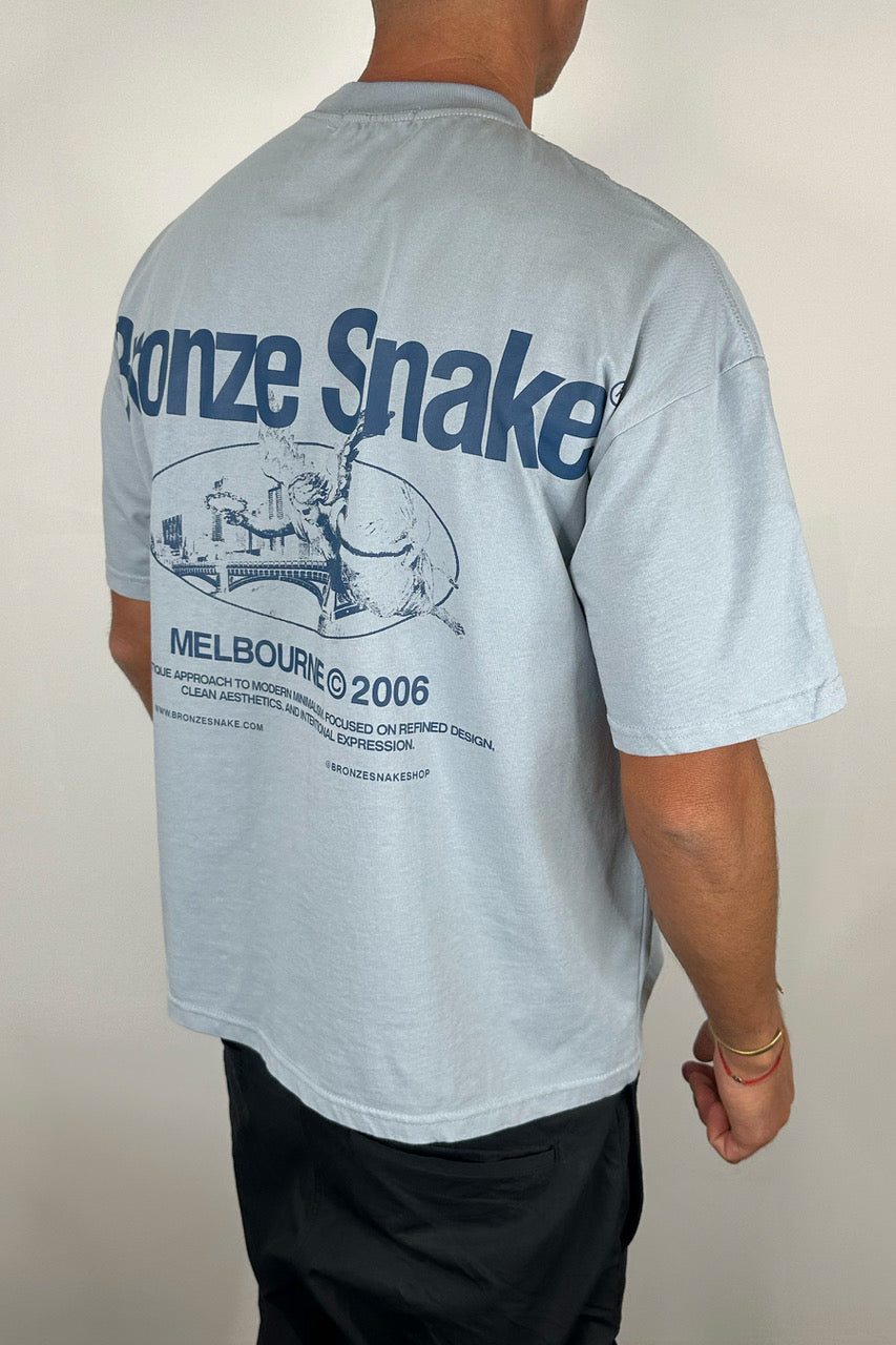 Bronze Snake Melb Tee Baby Blue