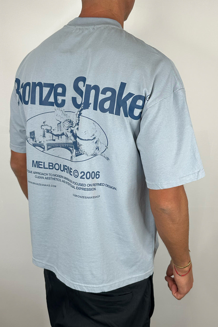 Bronze Snake Melb Tee Baby Blue