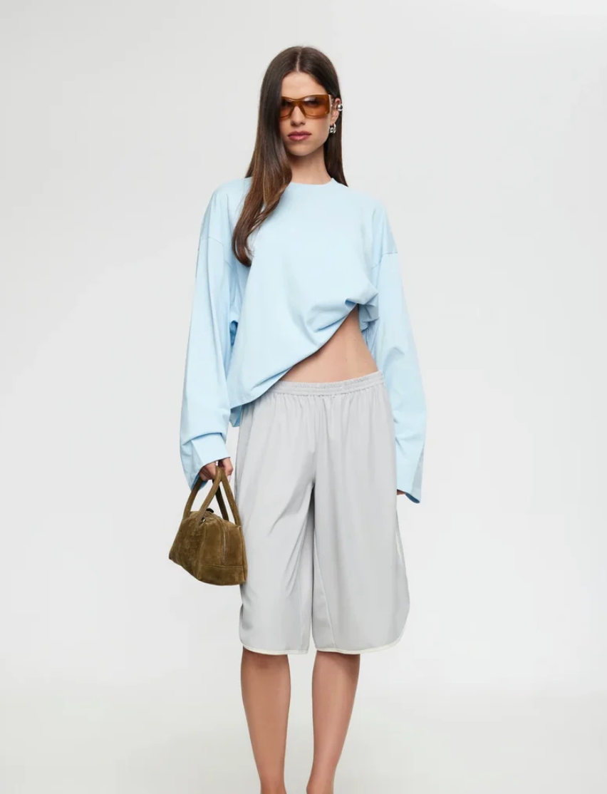 Set Aside the Your Old Baggy Tee —The Bloom Long Sleeve Is the Chic Airport Top We’re Wearing Instead