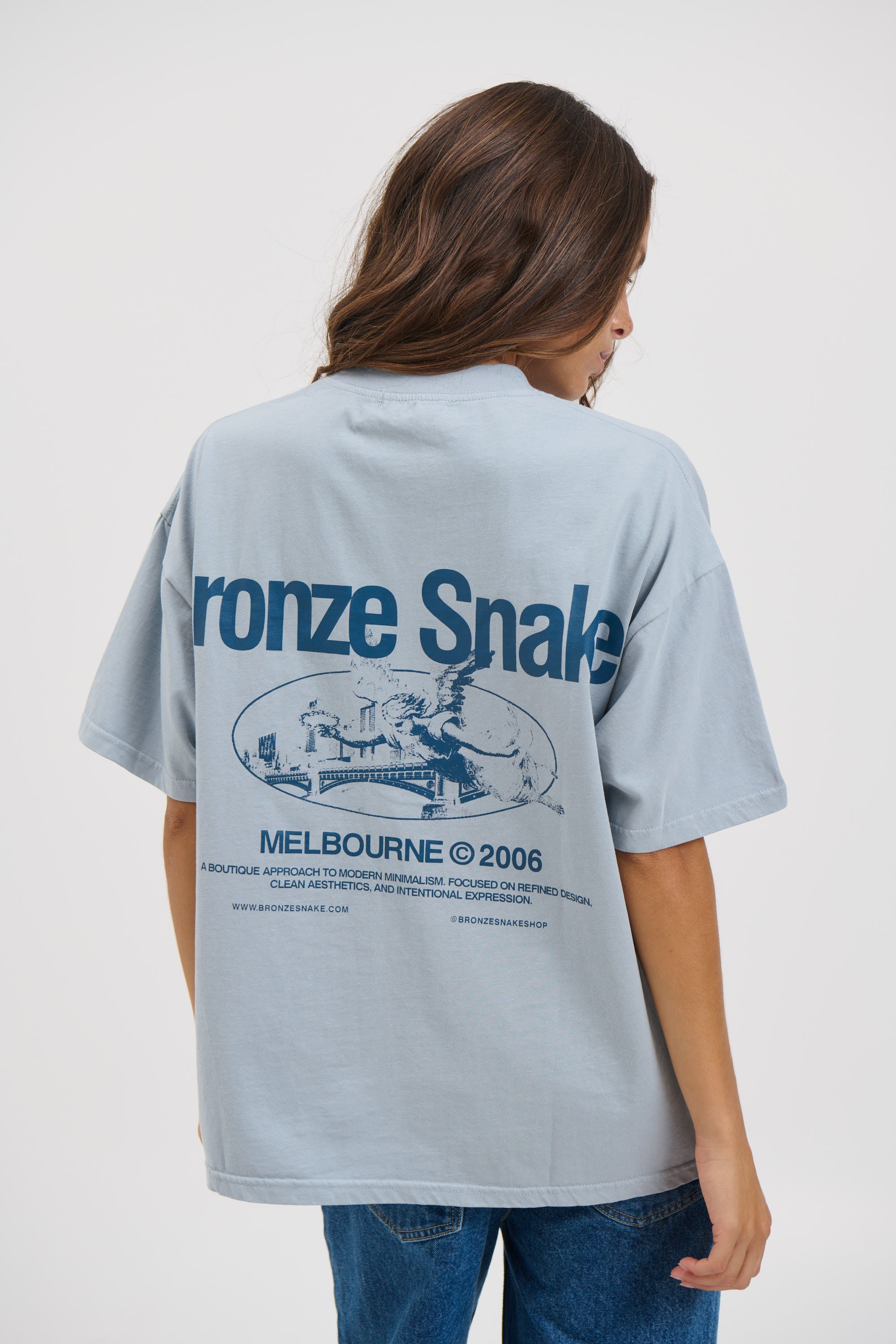 Unisex Bronze Snake Melb Tee Baby Blue